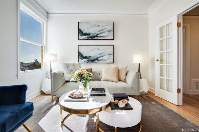 a living room with furniture and a table