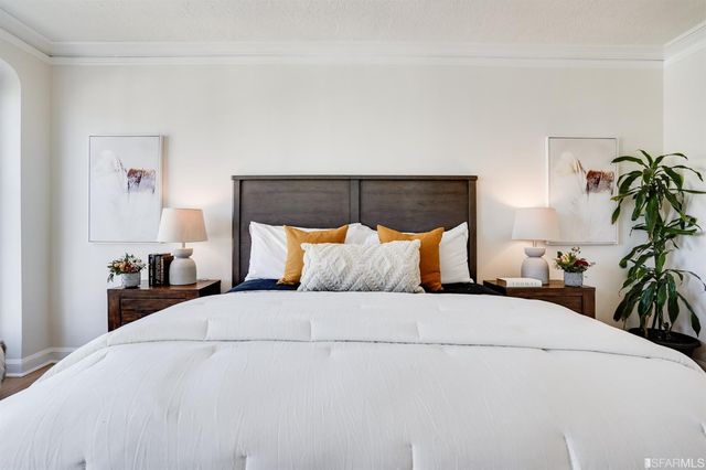 a bathroom with a bathtub sink vanity mirror and toilet