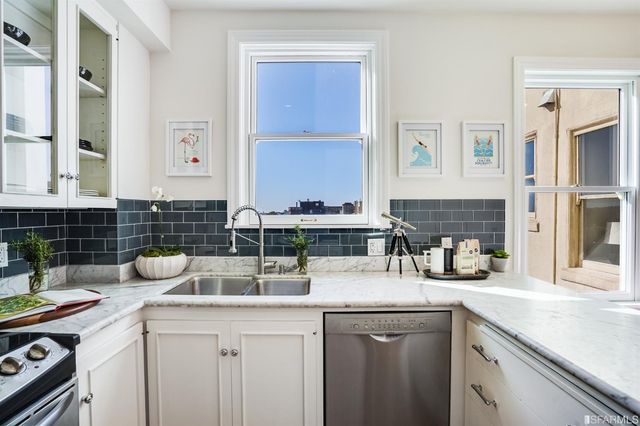 a kitchen with a sink and cabinets
