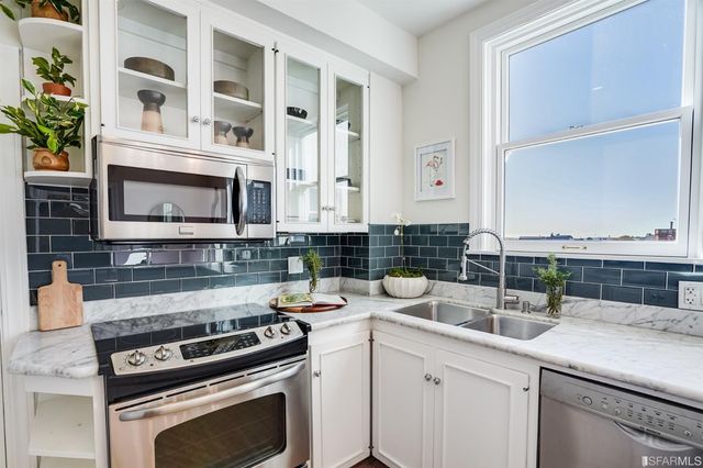 a kitchen with a stove and a sink