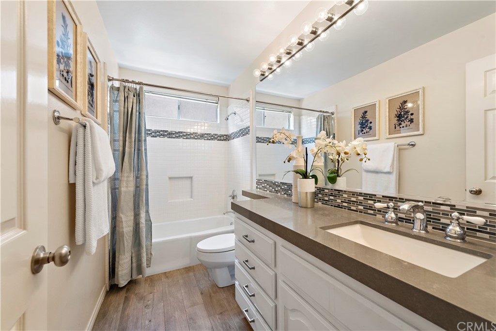 2 Tidemark Laguna Niguel, CA 92677 - Photo 14 of 57 a bathroom with a granite countertop double vanity sink a mirror and a shower