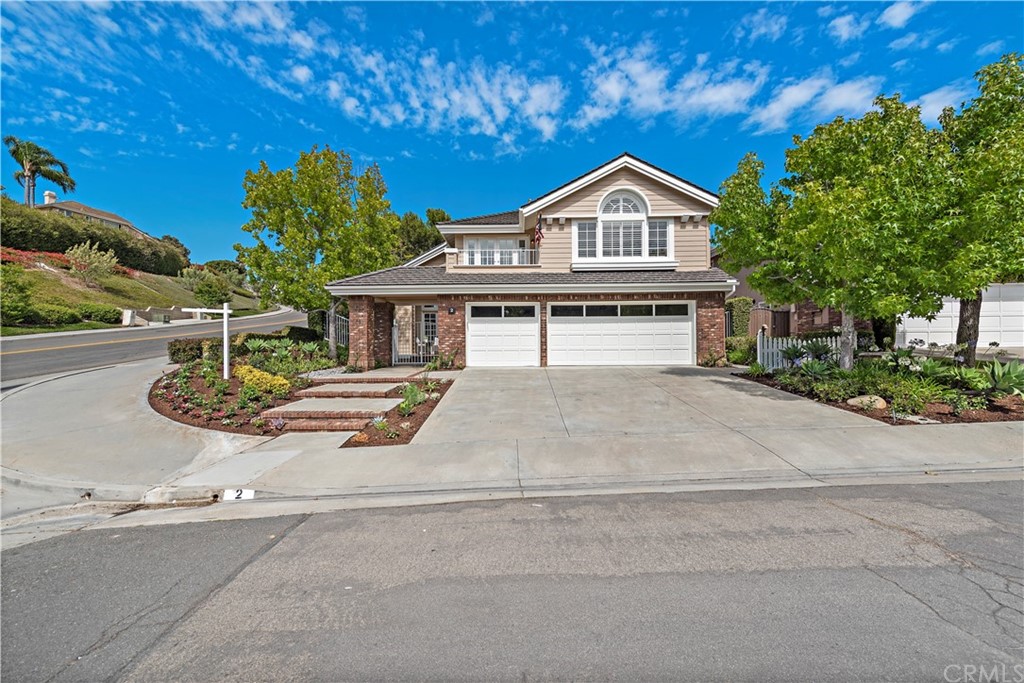 2 Tidemark Laguna Niguel, CA 92677 - Photo 22 of 57 a view of front of house with a yard and large trees