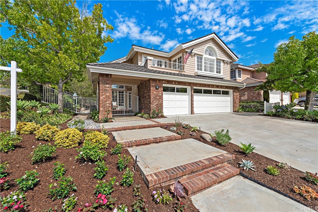 2 Tidemark Laguna Niguel, CA 92677 - Photo 27 of 57 a front view of a house with a garden and patio