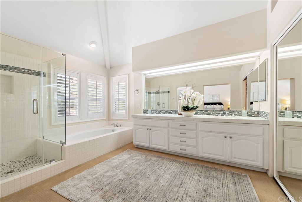 2 Tidemark Laguna Niguel, CA 92677 - Photo 32 of 57 a spacious bathroom with a tub sink shower and mirror