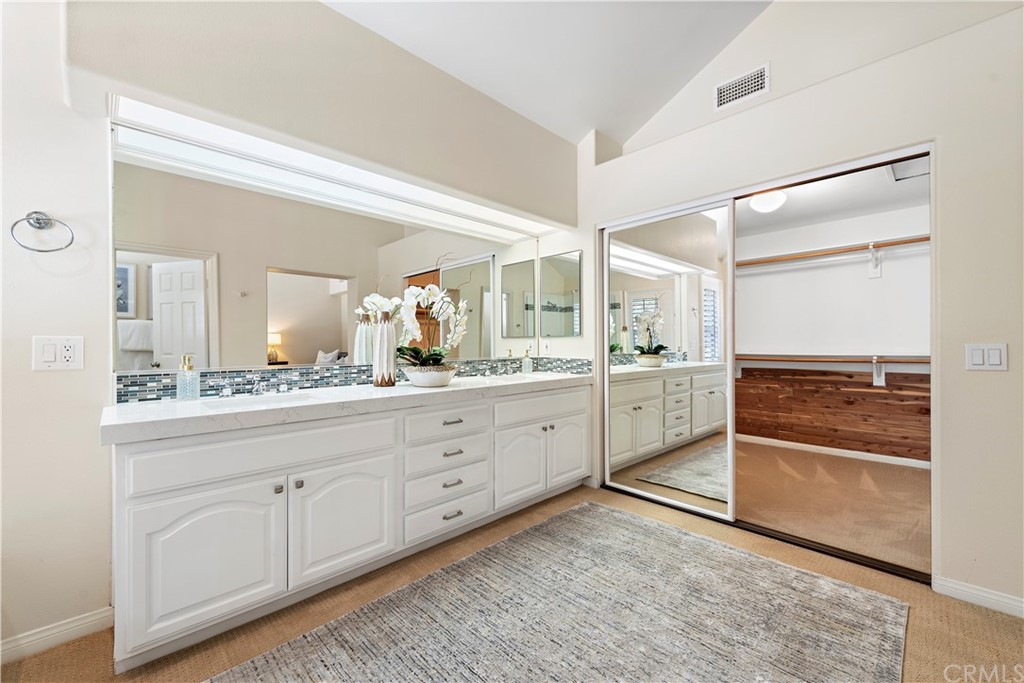 2 Tidemark Laguna Niguel, CA 92677 - Photo 33 of 57 a spacious bathroom with a granite countertop sink mirror and
