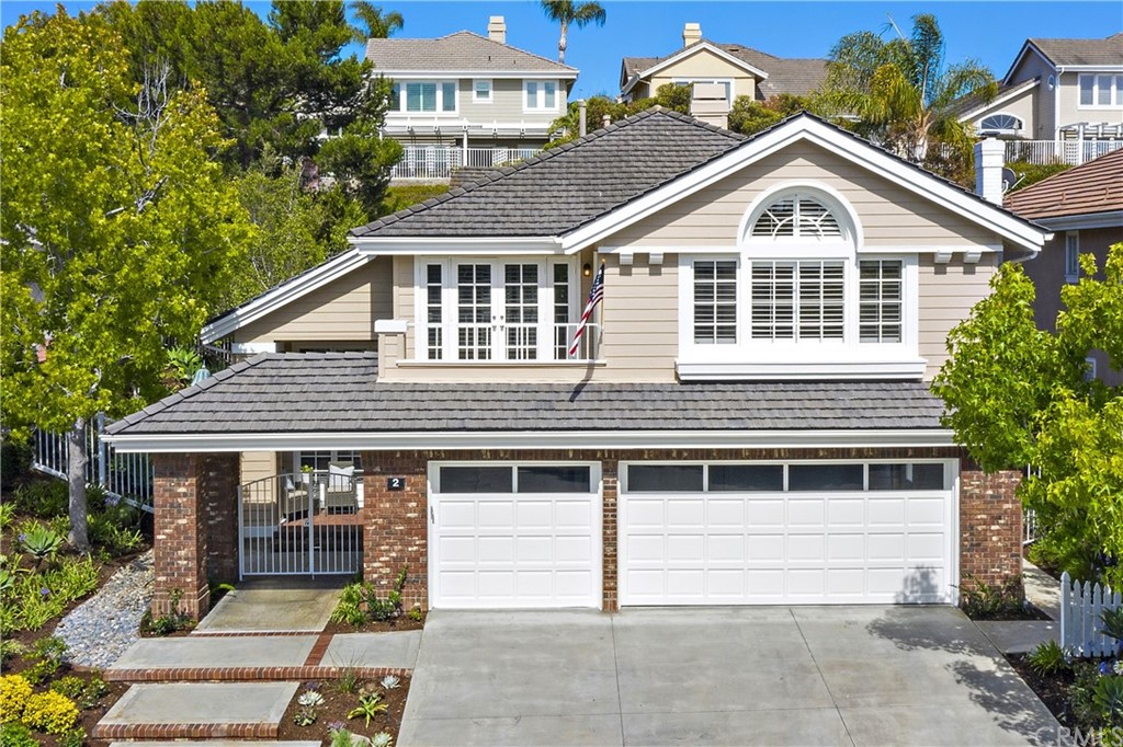 2 Tidemark Laguna Niguel, CA 92677 - Photo 42 of 57 a front view of a house with a garage