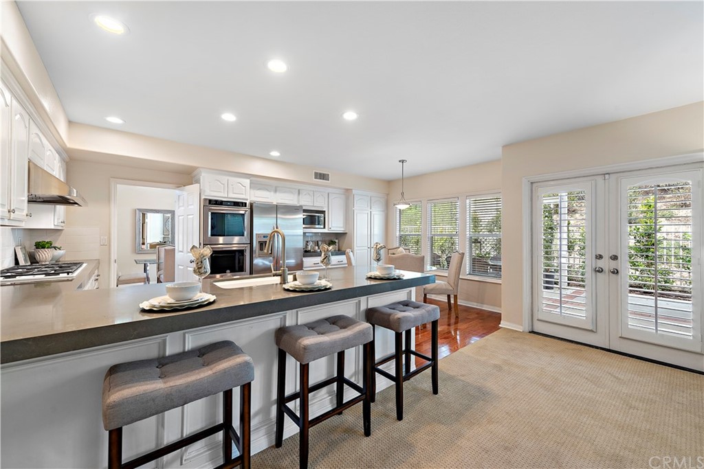 2 Tidemark Laguna Niguel, CA 92677 - Photo 8 of 57 a large kitchen with a table and chairs