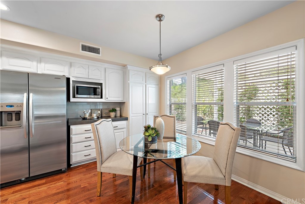 2 Tidemark Laguna Niguel, CA 92677 - Photo 9 of 57 a view of a dining room with furniture large window and wooden floor