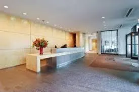 a large white kitchen with a large window