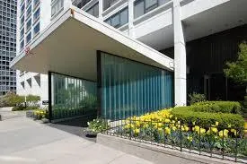 a view of a house with a garden and pathway