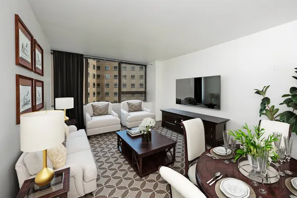 a living room with furniture a flat screen tv and a floor to ceiling window