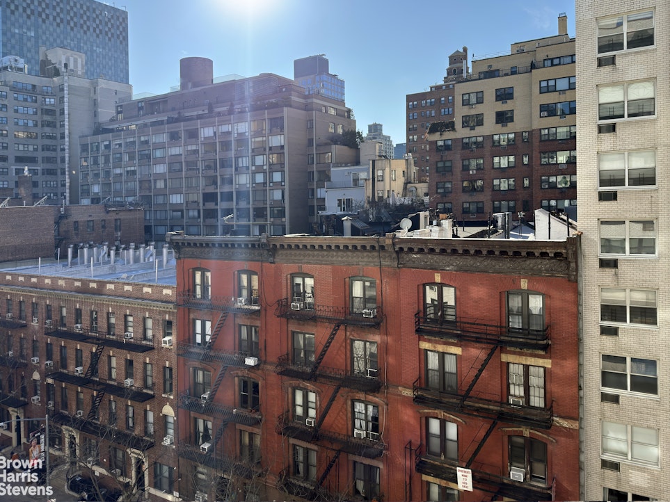 315 East 70th Street, Unit 8G Manhattan, NY 10021 - Photo 13 of 16 a view of a city with tall buildings