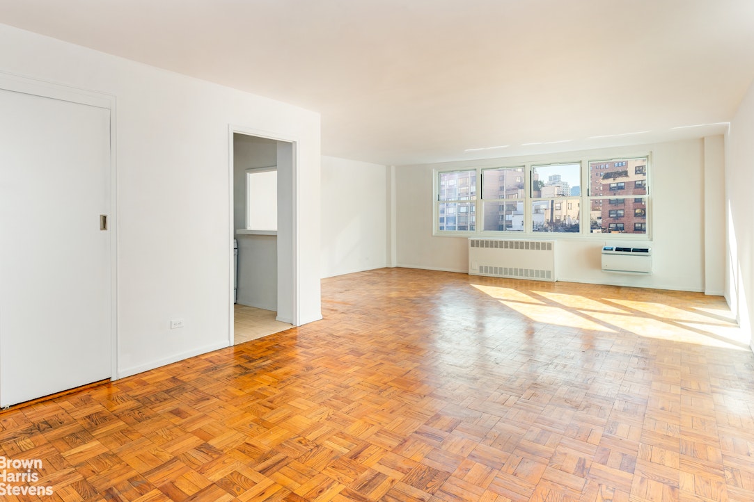 315 East 70th Street, Unit 8G Manhattan, NY 10021 - Photo 2 of 16 a view of empty room with wooden floor