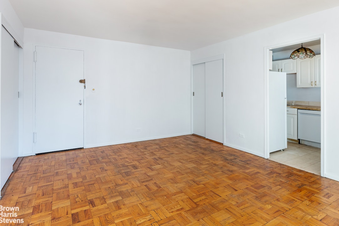 315 East 70th Street, Unit 8G Manhattan, NY 10021 - Photo 5 of 16 a view of empty room with wooden floor