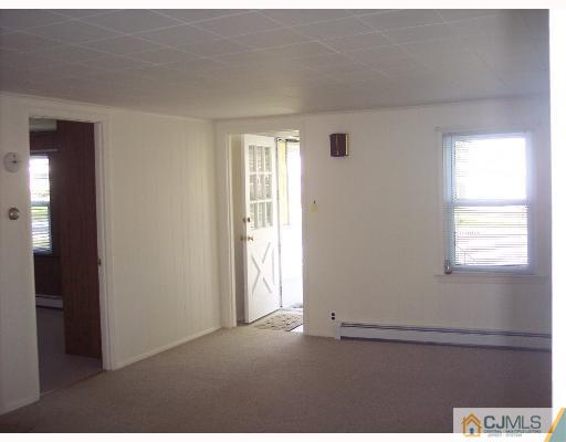 636 Myrtle Road North Brunswick, NJ 08902 - Photo 4 of 8 a view of an empty room and a window