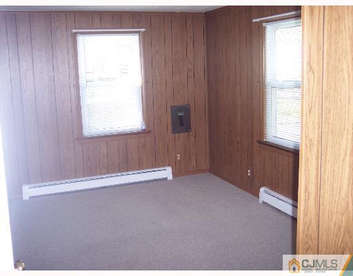 636 Myrtle Road North Brunswick, NJ 08902 - Photo 5 of 8 a view of an empty room with a window