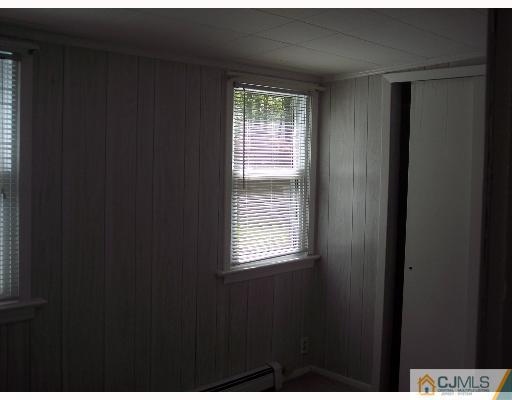 636 Myrtle Road North Brunswick, NJ 08902 - Photo 8 of 8 a view of an empty room with a window