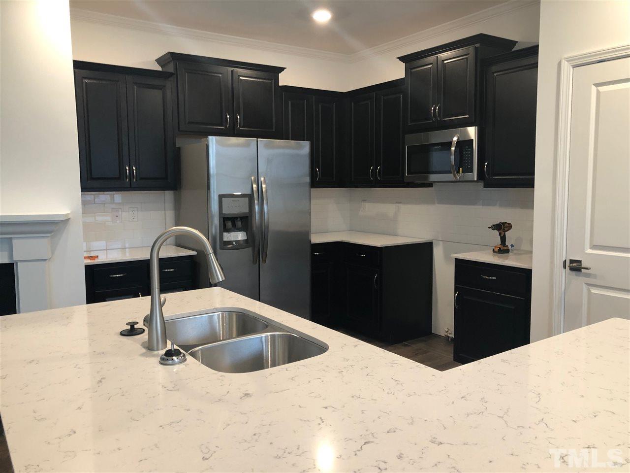 5409 Advancing Avenue, Unit 1099 Raleigh, NC 27616 - Photo 3 of 19 Example of kitchen finishes selected for this home