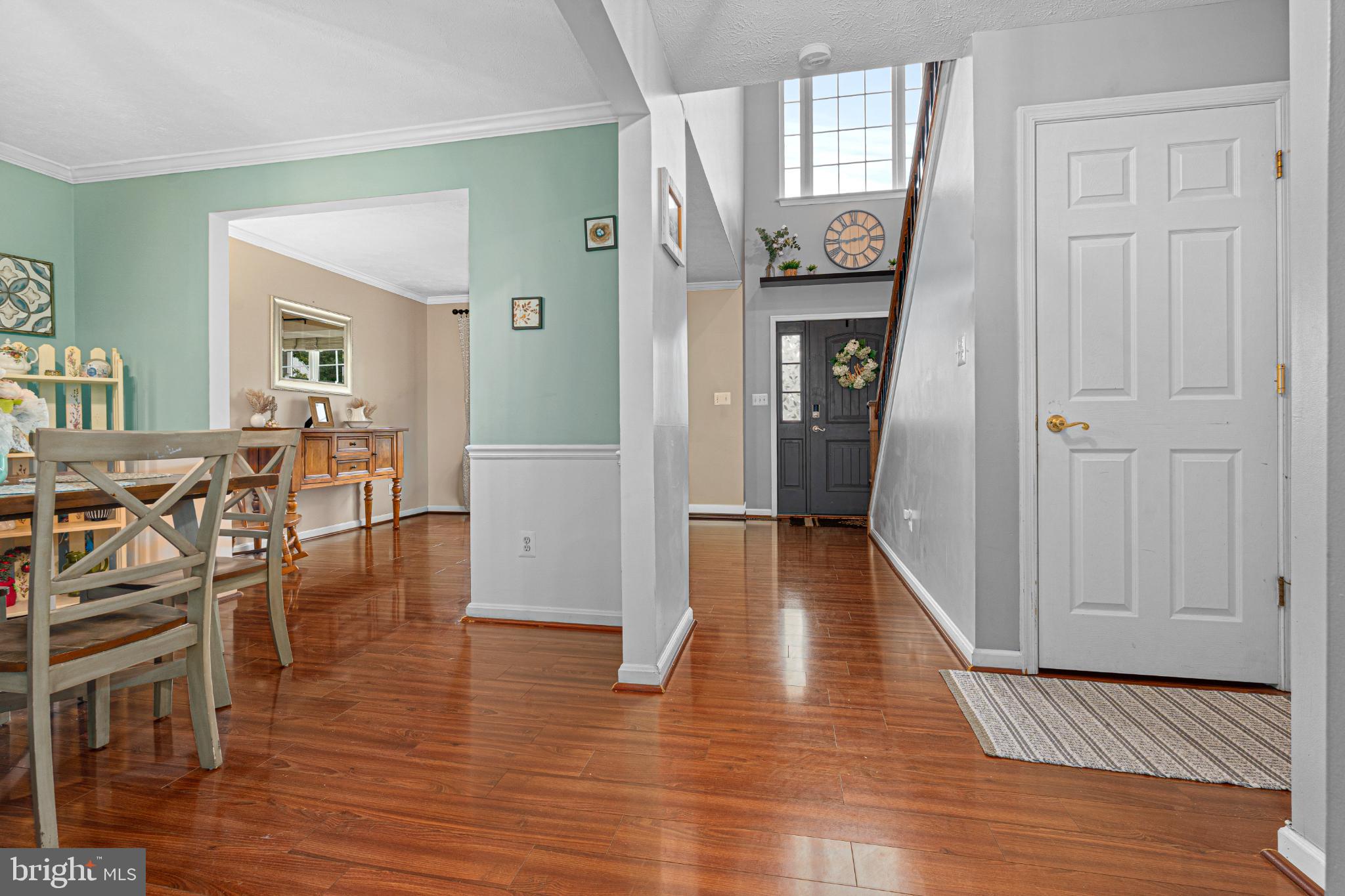 4635 Greencove Circle Sparrows Point, MD 21219 - Photo 12 of 48 a view of a hallway with wooden floor fireplace and dining room