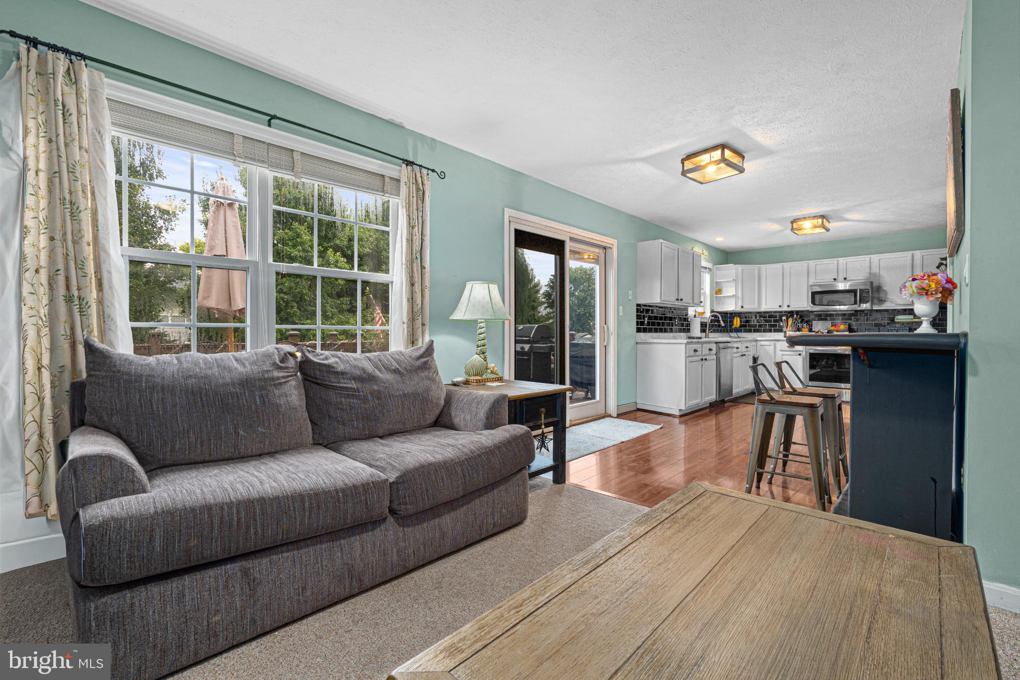 4635 Greencove Circle Sparrows Point, MD 21219 - Photo 17 of 48 a living room with furniture and a large window