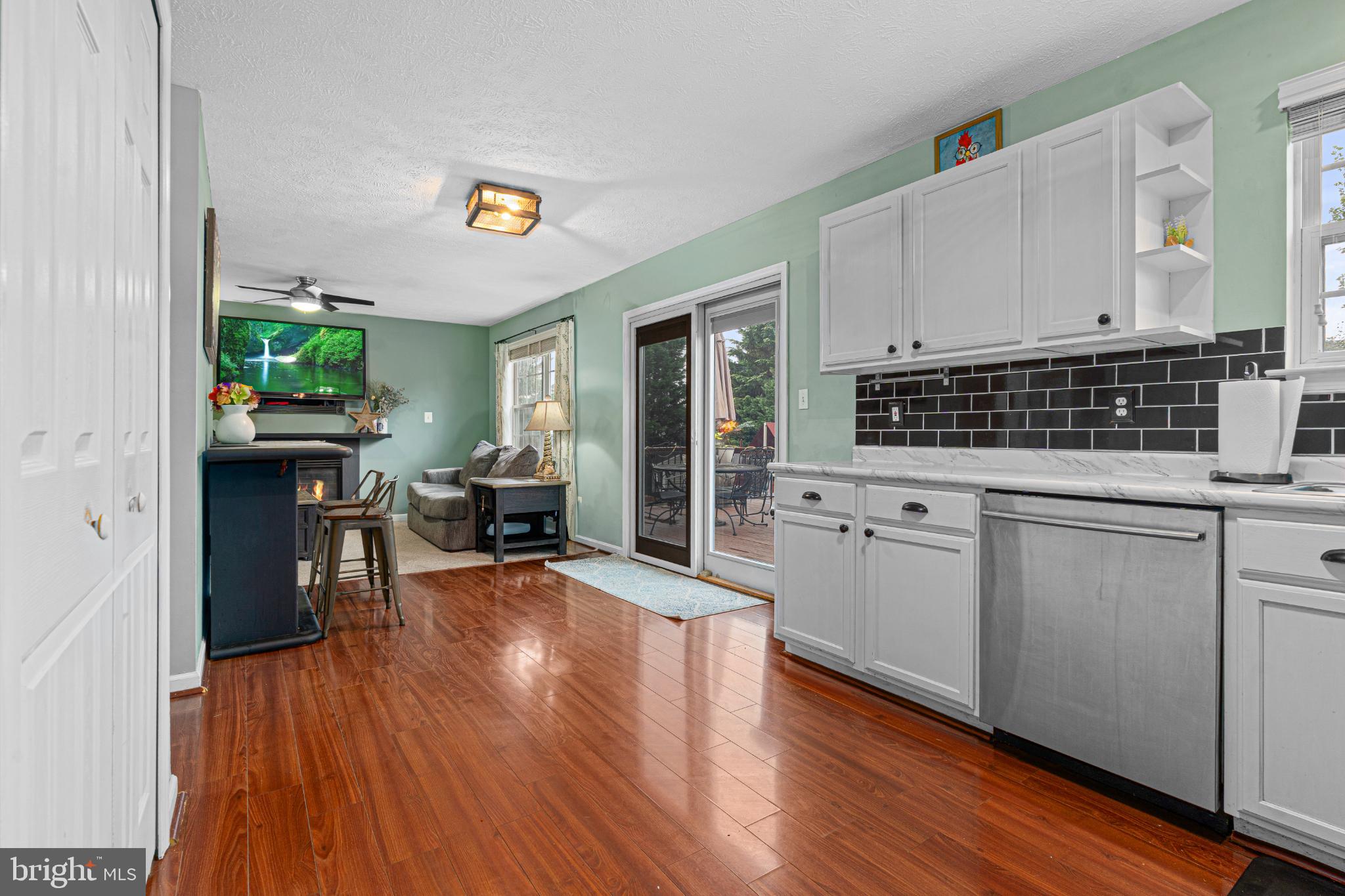 4635 Greencove Circle Sparrows Point, MD 21219 - Photo 21 of 48 a kitchen with stainless steel appliances a stove top oven and a wooden floors