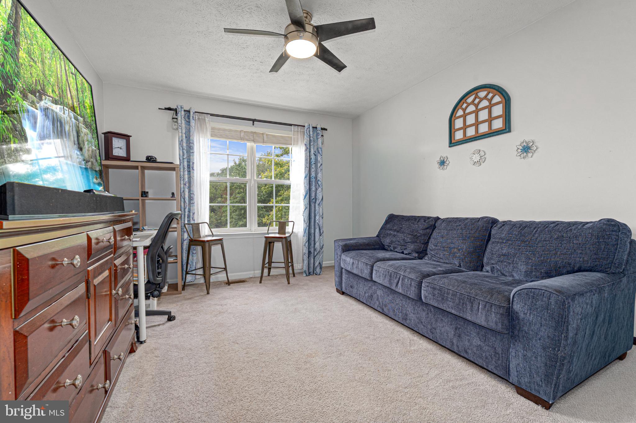4635 Greencove Circle Sparrows Point, MD 21219 - Photo 23 of 48 a living room with furniture and a window