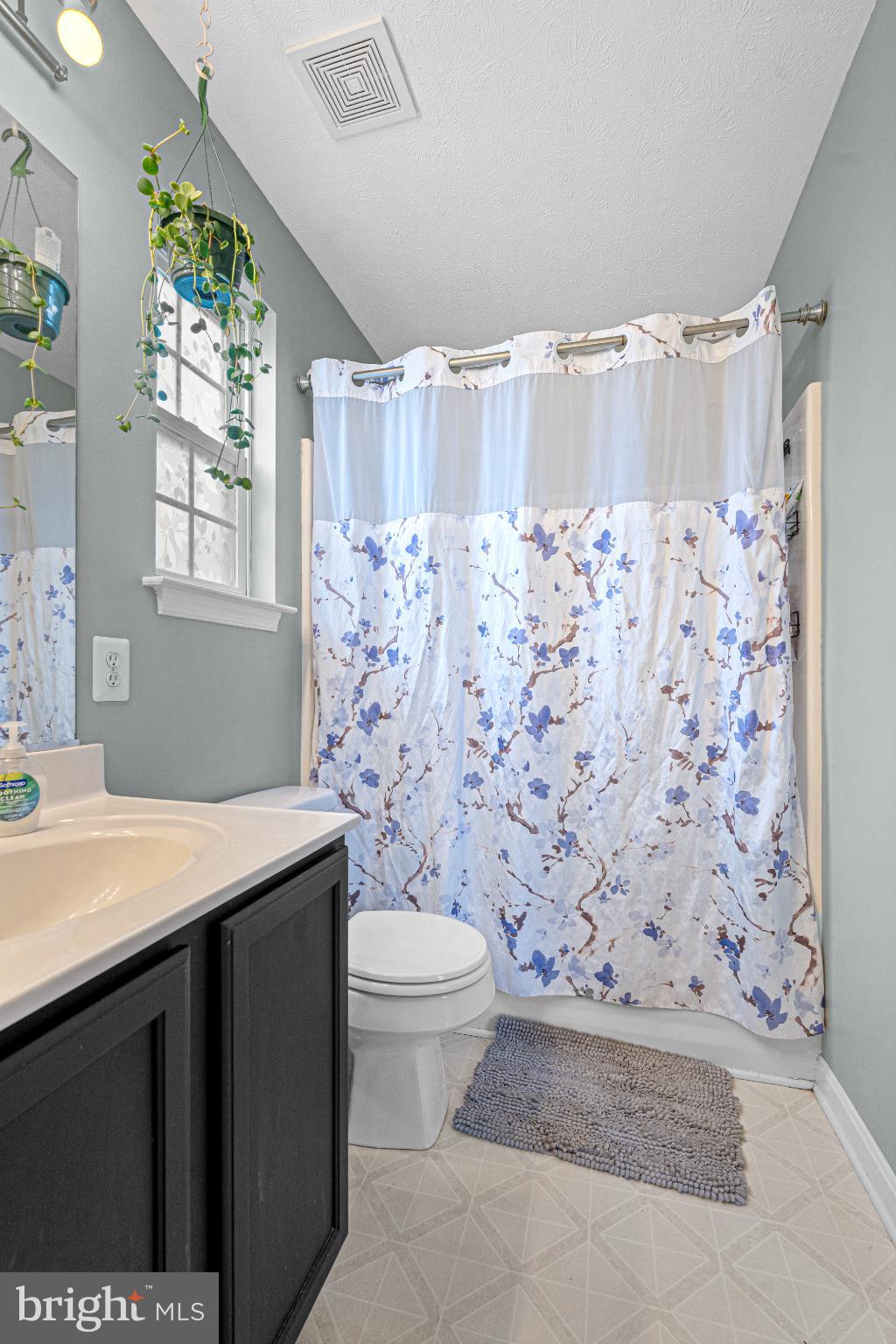 4635 Greencove Circle Sparrows Point, MD 21219 - Photo 26 of 48 a bathroom with a granite countertop sink a toilet and a shower