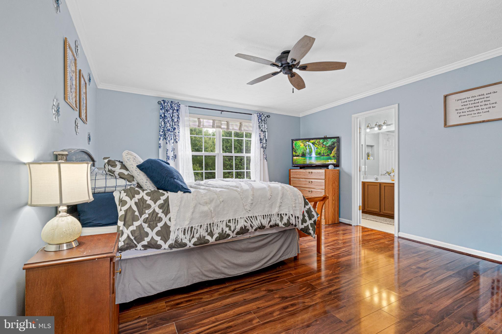 4635 Greencove Circle Sparrows Point, MD 21219 - Photo 27 of 48 a bed sitting in a spacious bedroom next to a window
