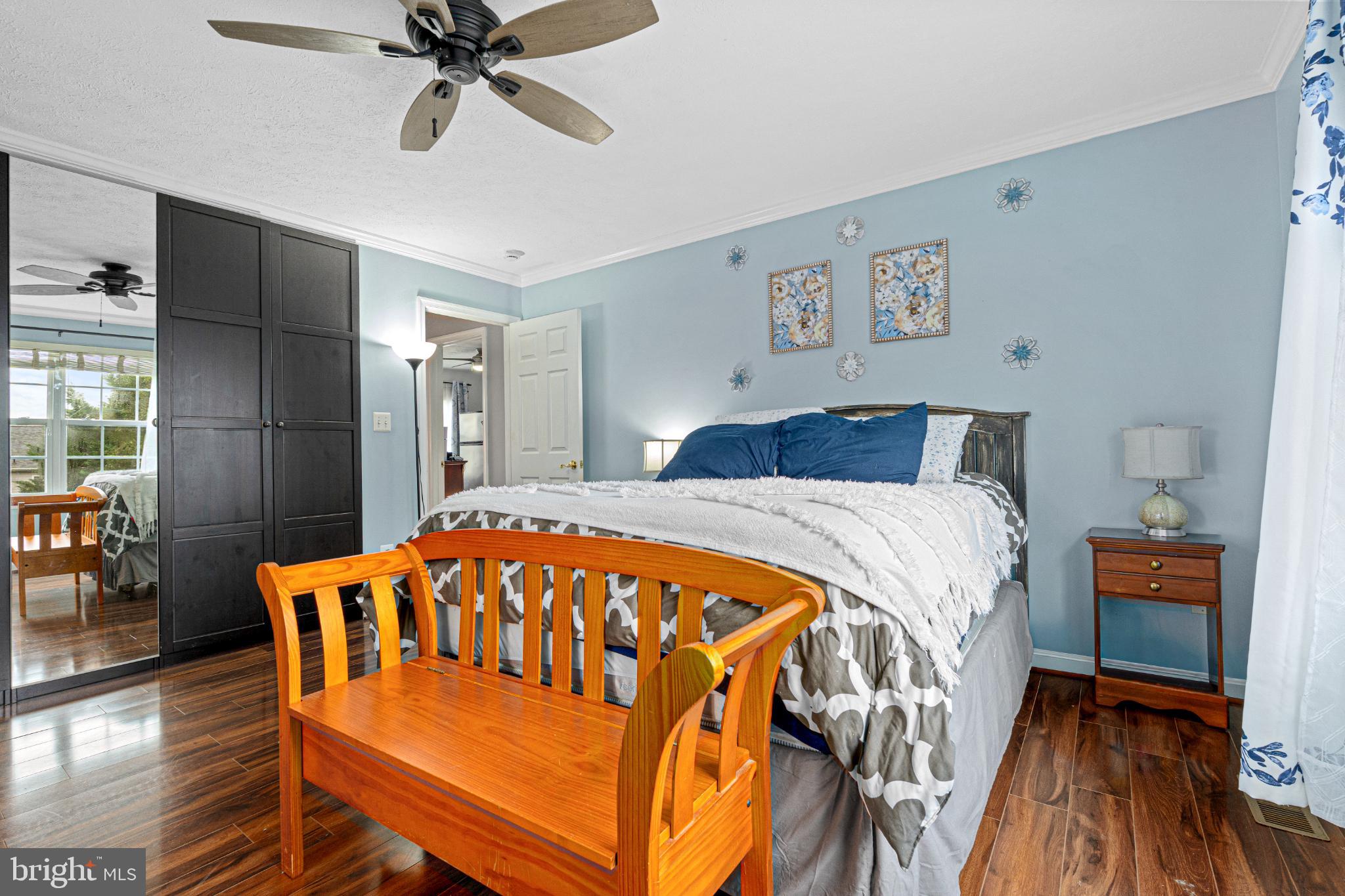 4635 Greencove Circle Sparrows Point, MD 21219 - Photo 29 of 48 a bedroom with a bed and a chandelier