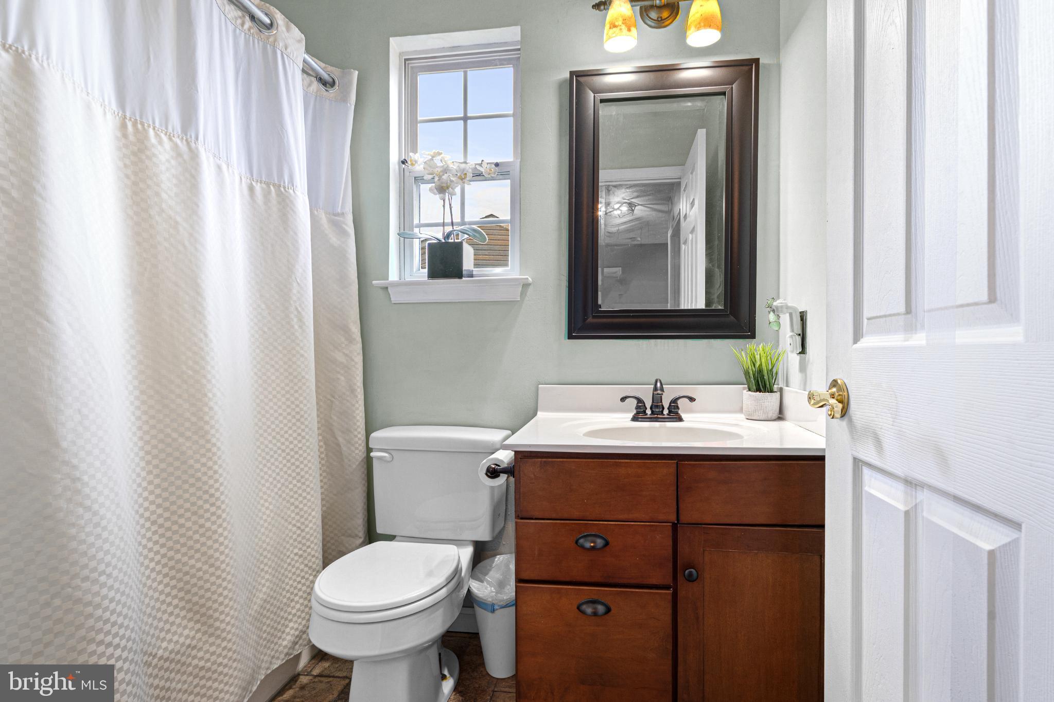 4635 Greencove Circle Sparrows Point, MD 21219 - Photo 32 of 48 a bathroom with a toilet sink and mirror