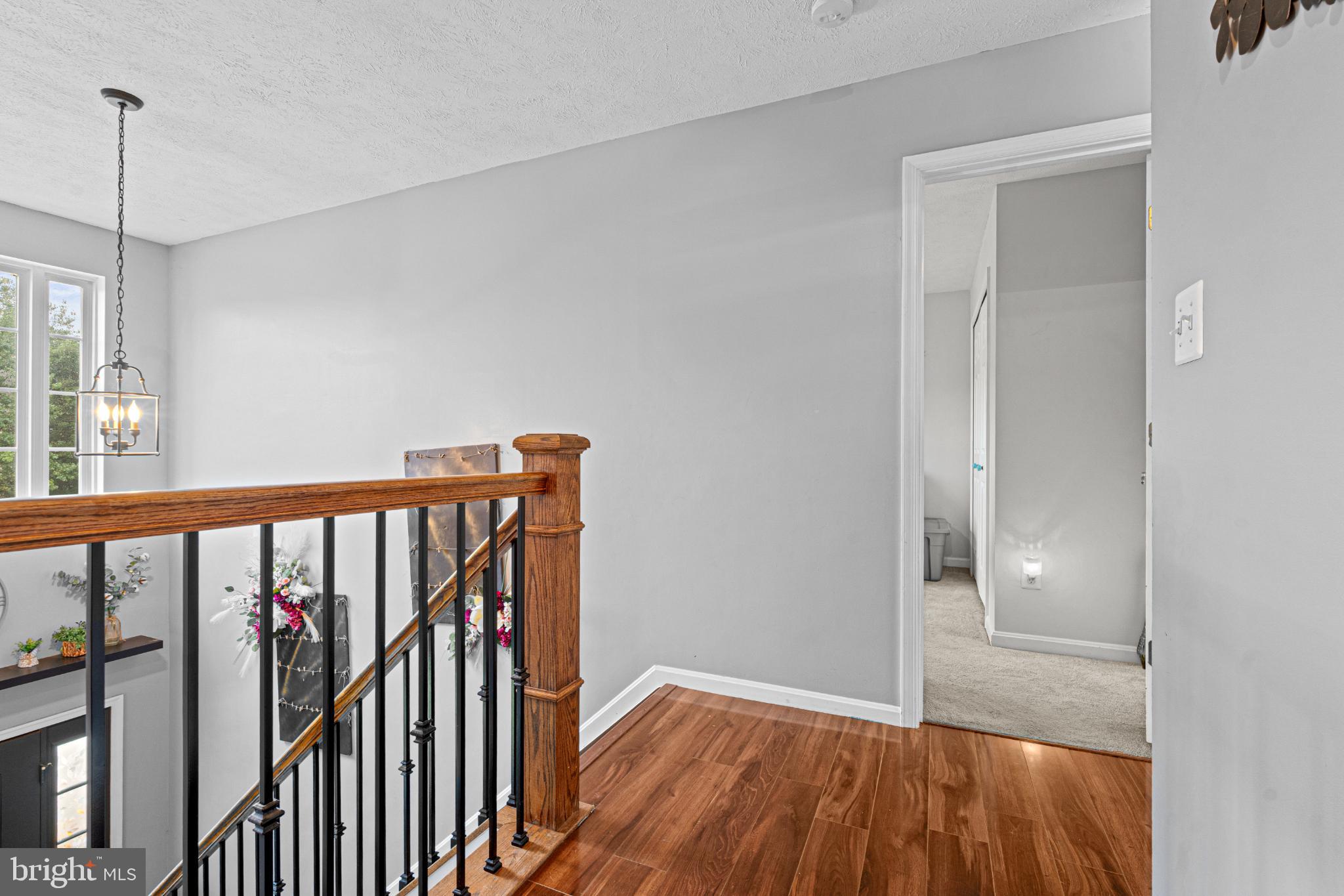 4635 Greencove Circle Sparrows Point, MD 21219 - Photo 33 of 48 a view of a hallway with wooden floor