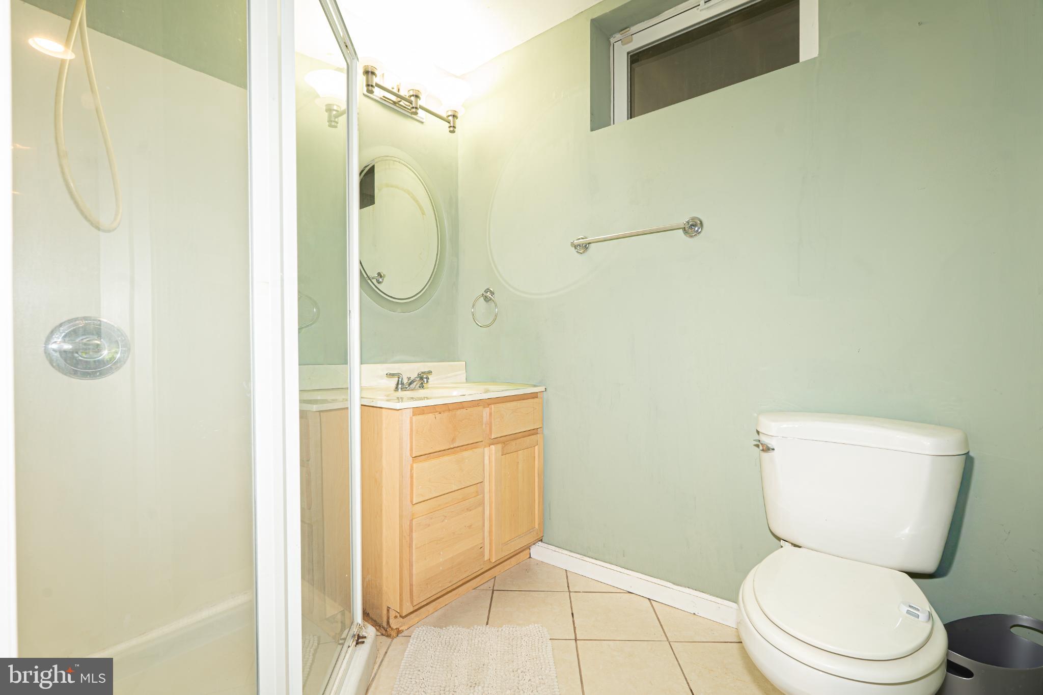 4635 Greencove Circle Sparrows Point, MD 21219 - Photo 37 of 48 a bathroom with a toilet sink and shower