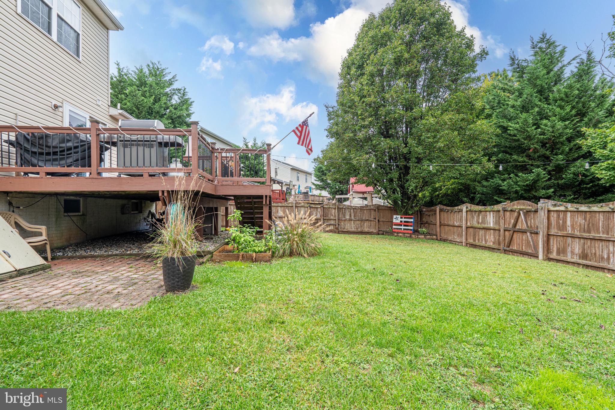 4635 Greencove Circle Sparrows Point, MD 21219 - Photo 41 of 48 a backyard of a house with table and chairs