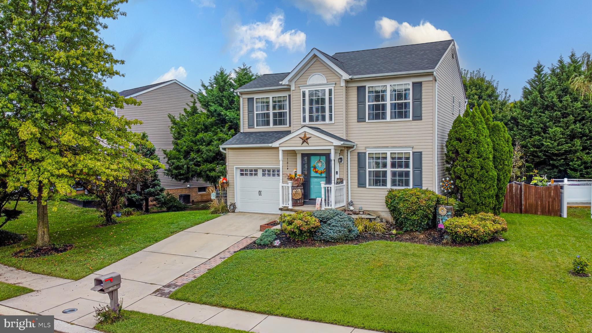 4635 Greencove Circle Sparrows Point, MD 21219 - Photo 43 of 48 a front view of a house with a garden