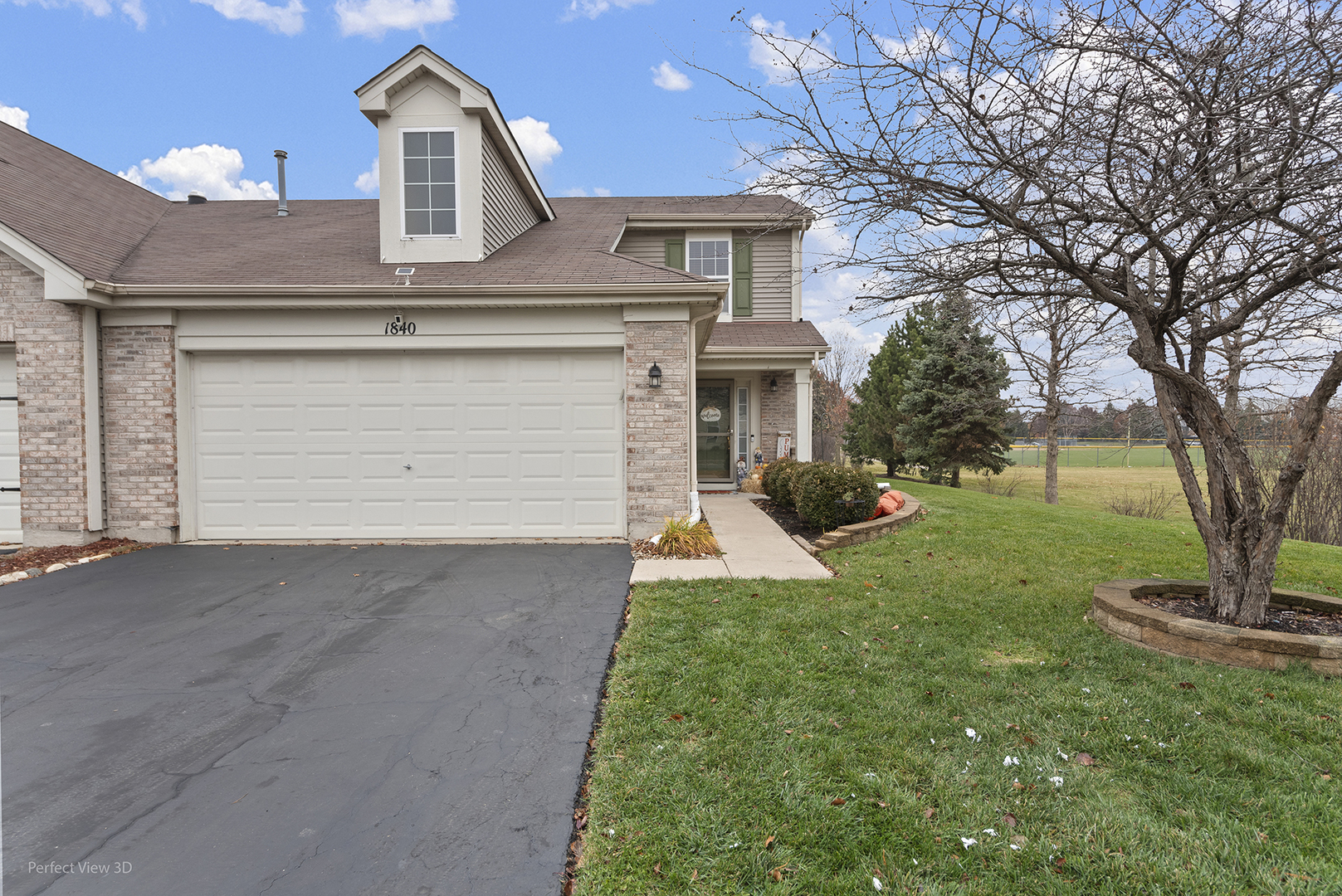 1840 Spinnaker Street Pingree Grove, IL 60140 - Photo 1 of 25 a front view of a house with a yard and garage