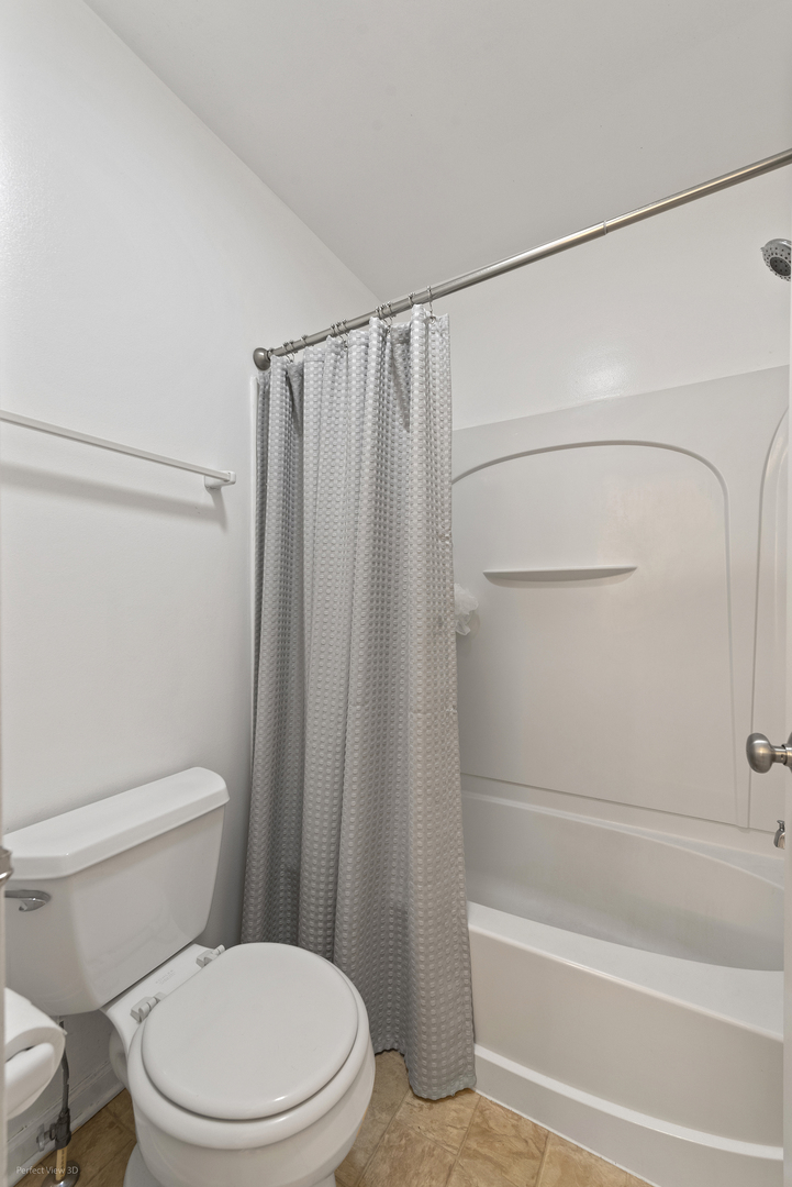 1840 Spinnaker Street Pingree Grove, IL 60140 - Photo 21 of 25 a white toilet sitting next to a bath tub and a shower