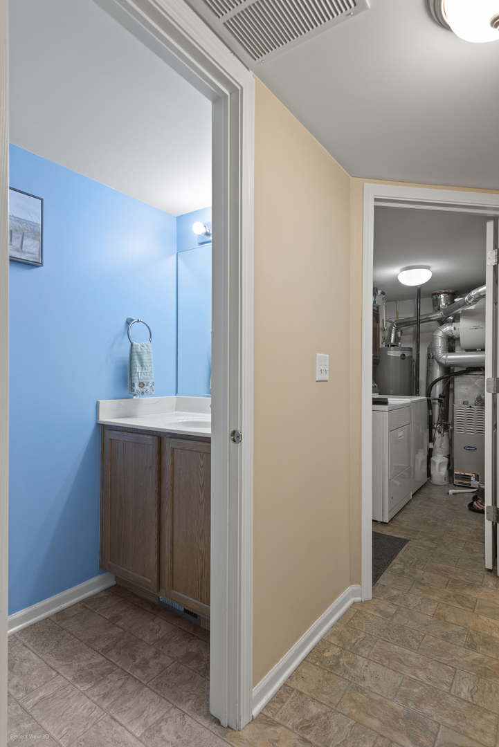 1840 Spinnaker Street Pingree Grove, IL 60140 - Photo 23 of 25 a view of a hallway with a kitchen