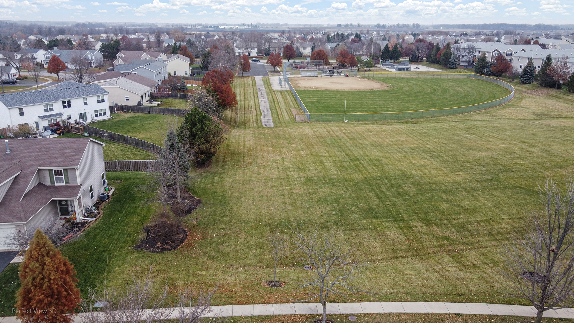 1840 Spinnaker Street Pingree Grove, IL 60140 - Photo 6 of 25 an aerial view of residential houses with outdoor space and swimming pool