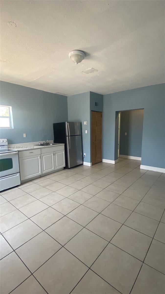 2014 Funston Street Hollywood, FL 33020 - Photo 3 of 5 a view of a livingroom with an empty space and a sink