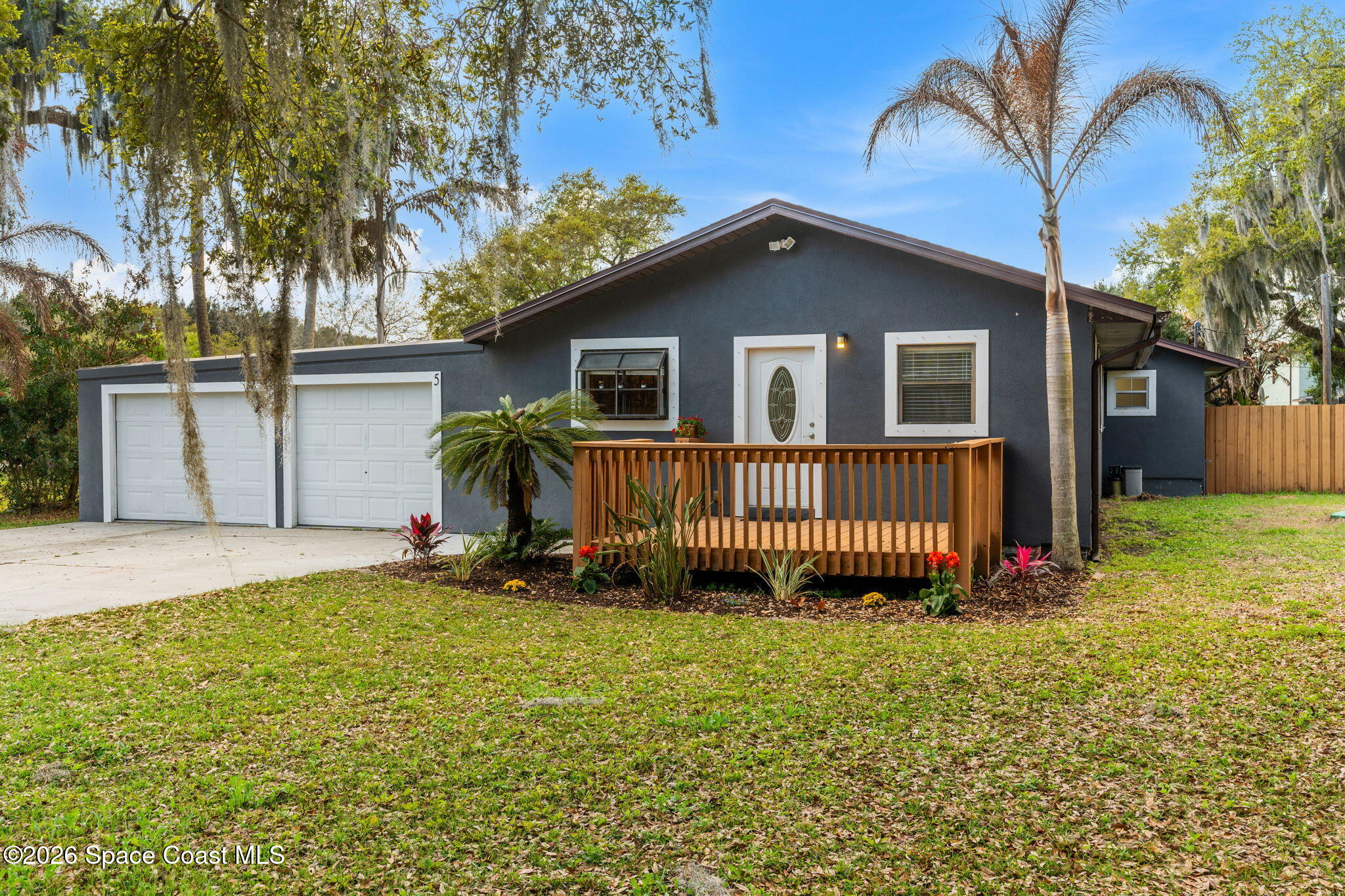5 Lee Street Cocoa, FL 32926 - Photo 1 of 29 a front view of a house with a garden