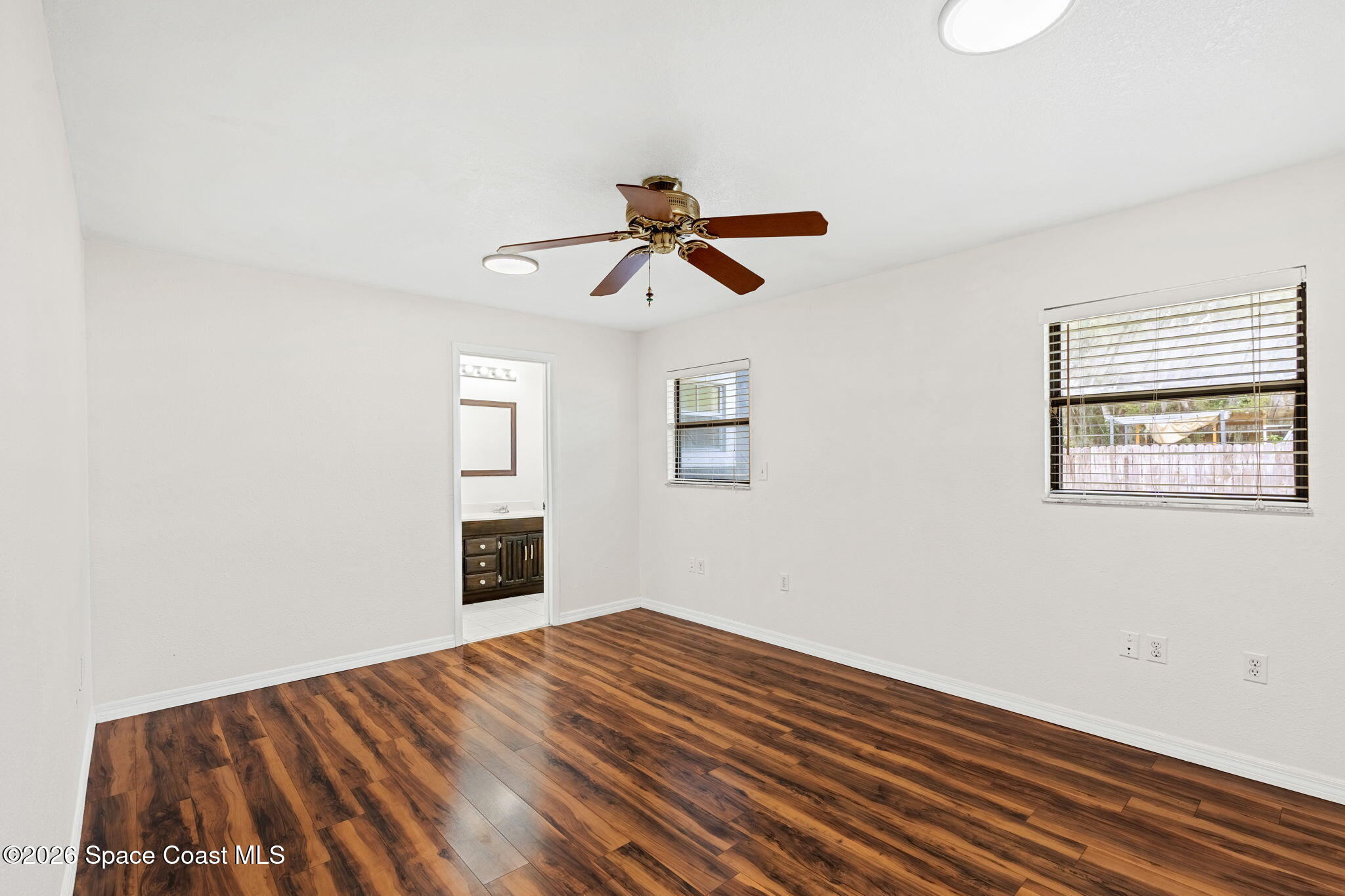 5 Lee Street Cocoa, FL 32926 - Photo 13 of 29 a view of empty room with wooden floor and fan