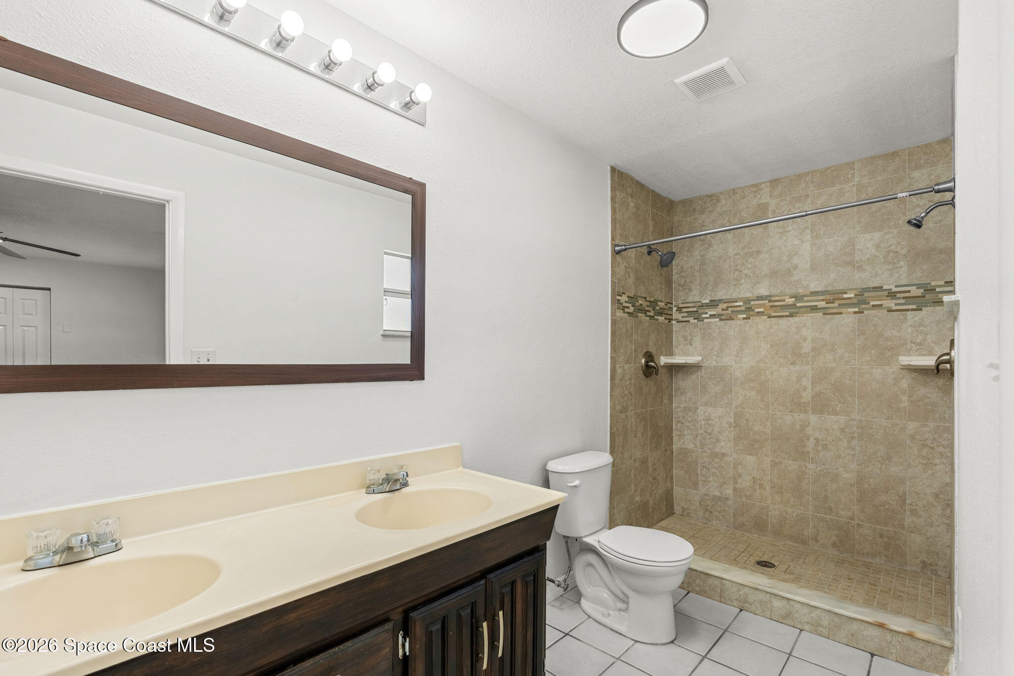 5 Lee Street Cocoa, FL 32926 - Photo 15 of 29 a bathroom with a sink a toilet and shower