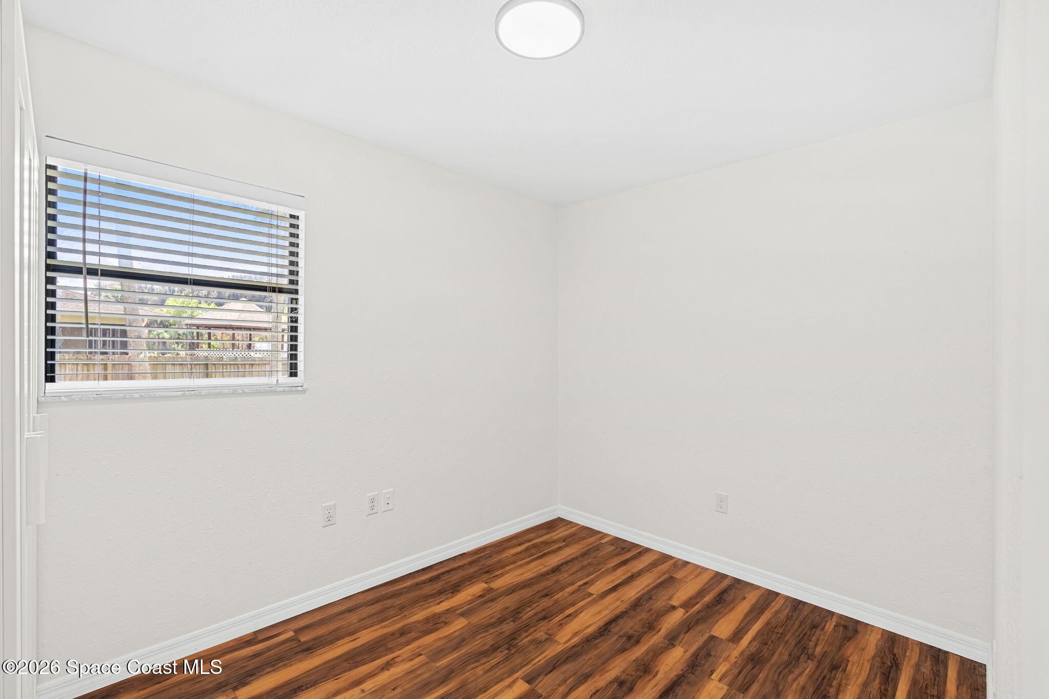 5 Lee Street Cocoa, FL 32926 - Photo 16 of 29 a view of a small space with wooden floor and a window