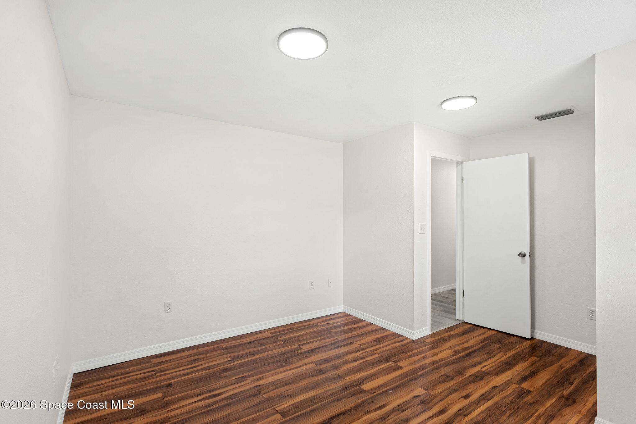 5 Lee Street Cocoa, FL 32926 - Photo 17 of 29 a view of room with wooden floor and fan