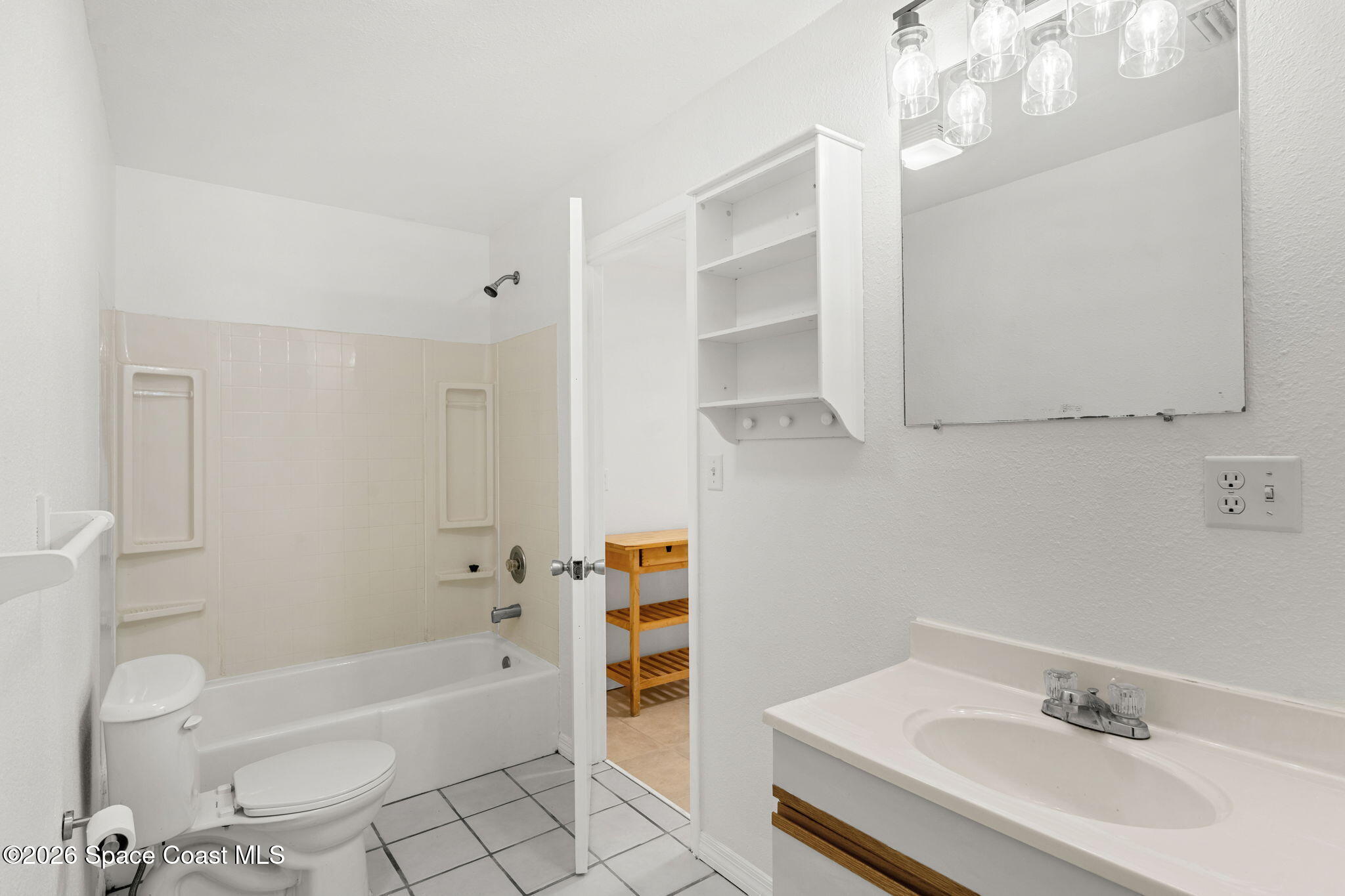 5 Lee Street Cocoa, FL 32926 - Photo 18 of 29 a bathroom with a sink a toilet and bathtub