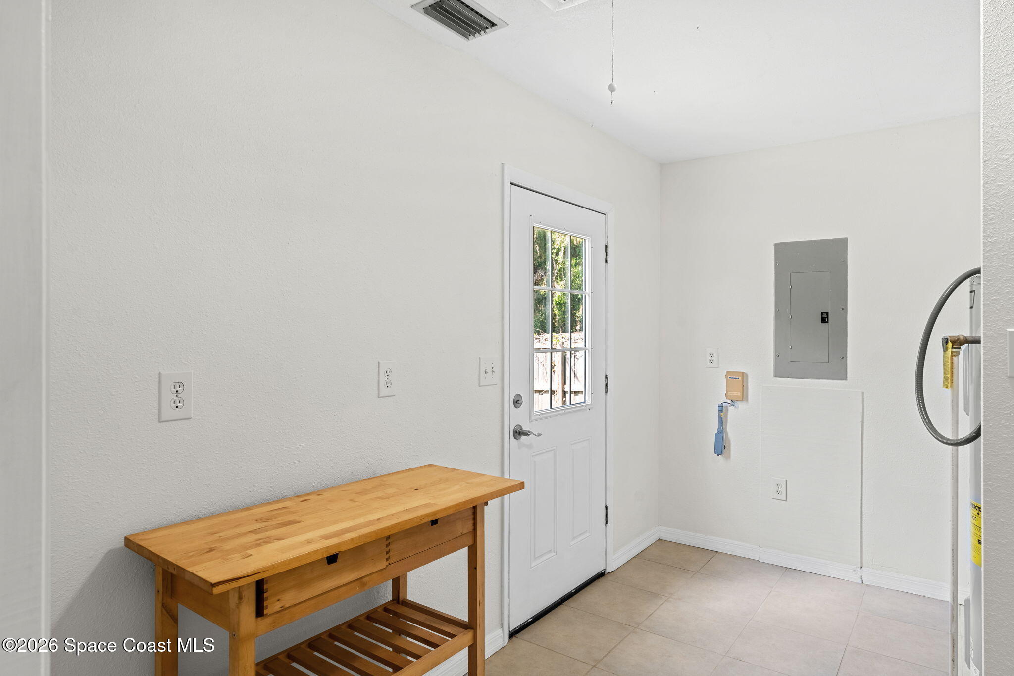 5 Lee Street Cocoa, FL 32926 - Photo 20 of 29 a room with a table and a window