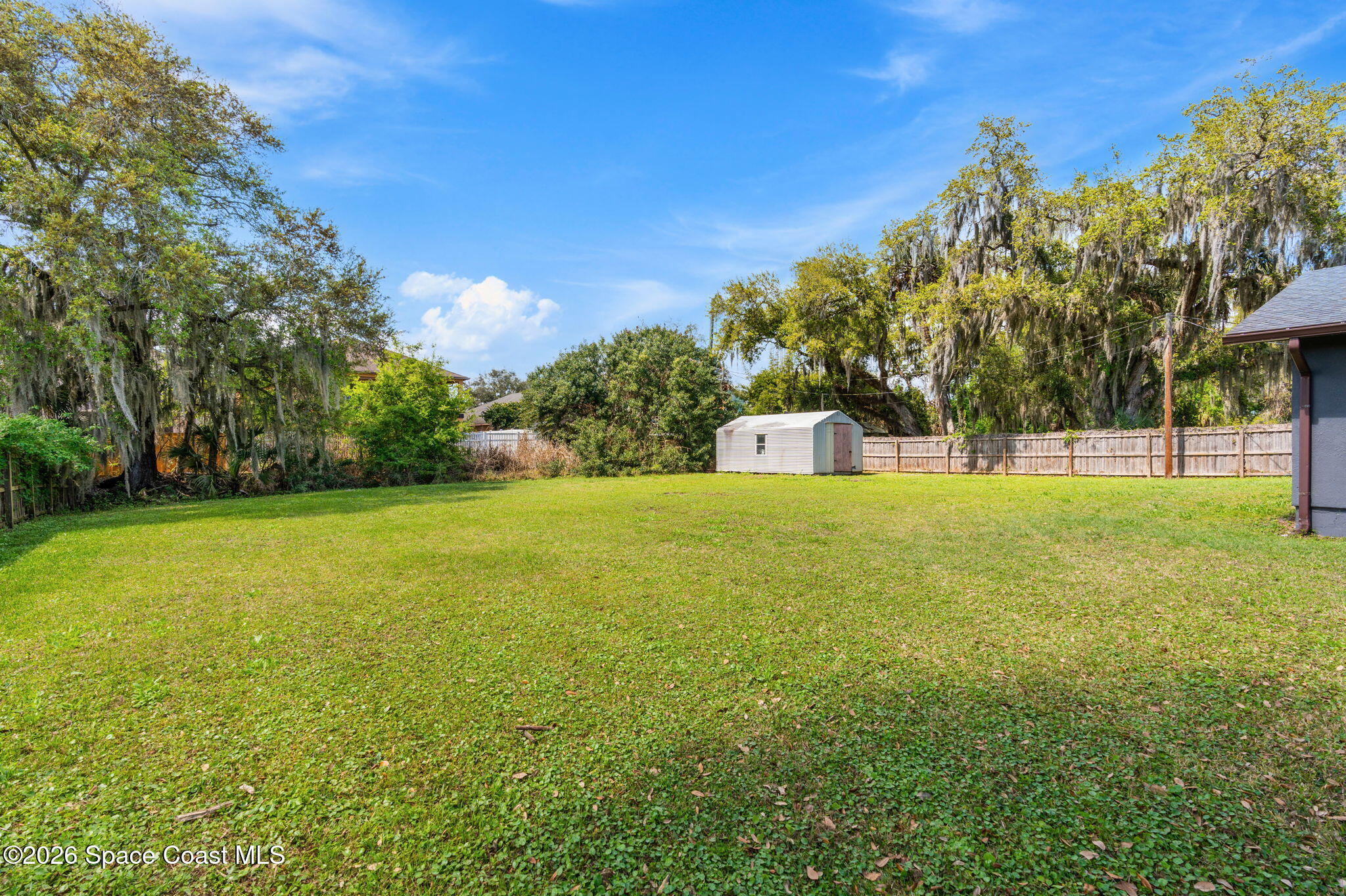 5 Lee Street Cocoa, FL 32926 - Photo 25 of 29 a view of outdoor space with garden and trees