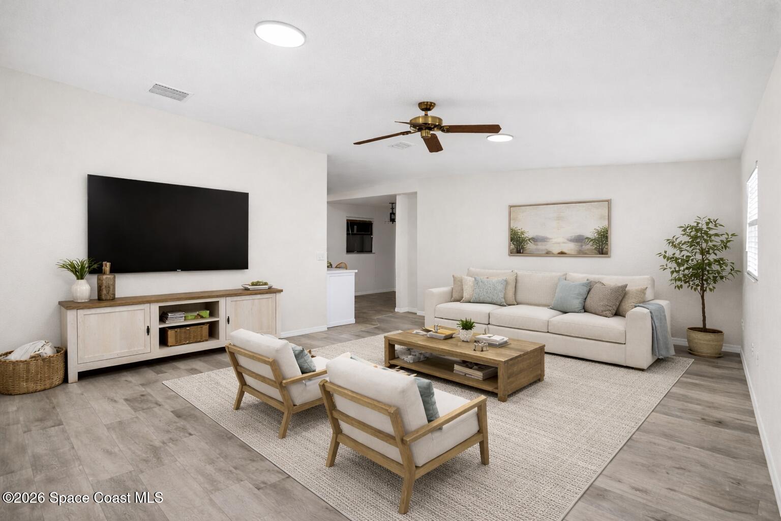5 Lee Street Cocoa, FL 32926 - Photo 4 of 29 a living room with furniture and a flat screen tv