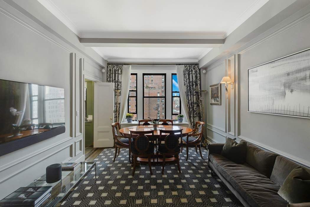 139 East 94th Street, Unit 11CD Manhattan, NY 10128 - Photo 11 of 28 a view of a dining room with furniture window and wooden floor