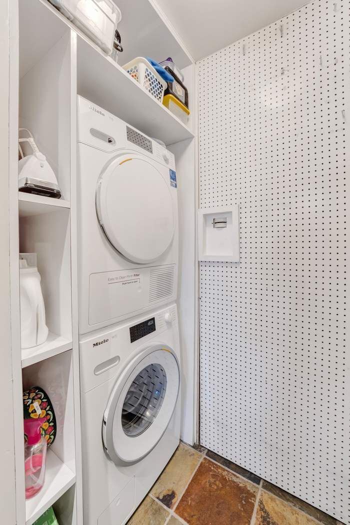 139 East 94th Street, Unit 11CD Manhattan, NY 10128 - Photo 22 of 28 a utility room with dryer and washer